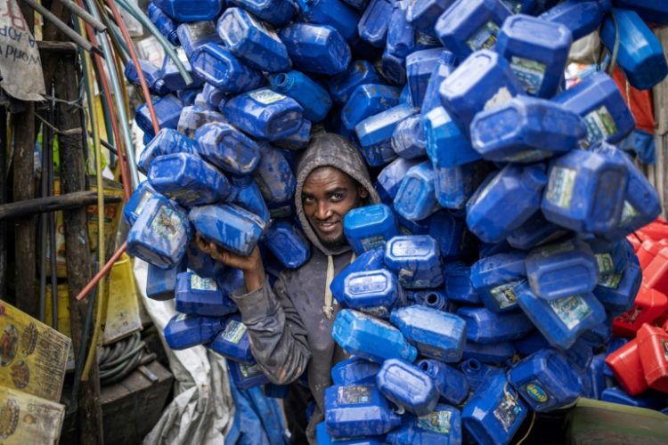 Ezedin Muste, 23, is one of thousands of waste collectors known in Amharic as 'korale' . ©AFP