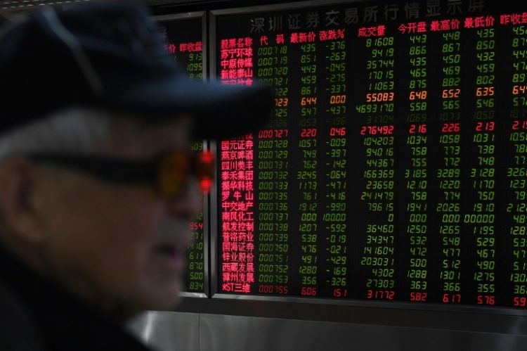 Asian markets fell with Wall Street as traders fret over this year's AI-fuelled tech rally. ©AFP