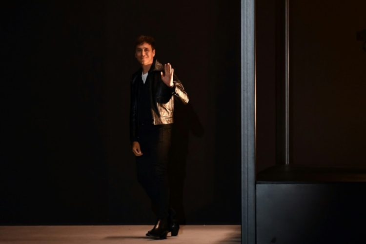 Celine said Slimane, seen greeting fashionistas at the Paris launch of a 2020 men's collection, had taken the firm on an "extraordinary journey". ©AFP