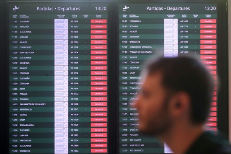 Canceled flights are highlighted in red during a massive transit strike in Argentina, aimed at protesting President Javier Milei's economic policies, at the at the Jorge Newbery Metropolitan Airport in Buenos Aires on October 30, 2024. ©AFP