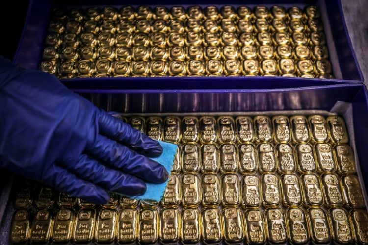 Bullion hit a fresh record high on geopolitical tensions as traders keep track of developments in the Middle East. ©AFP