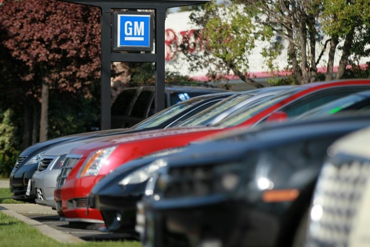 A heavy calendar of earnings this week includes third-quarter results from General Motors . ©AFP