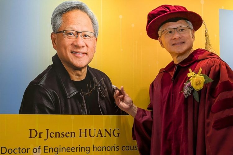 Nvidia CEO Jensen Huang poses for a photo after receiving an honorary doctorate in engineering from the Hong Kong University of Science and Technology. ©AFP