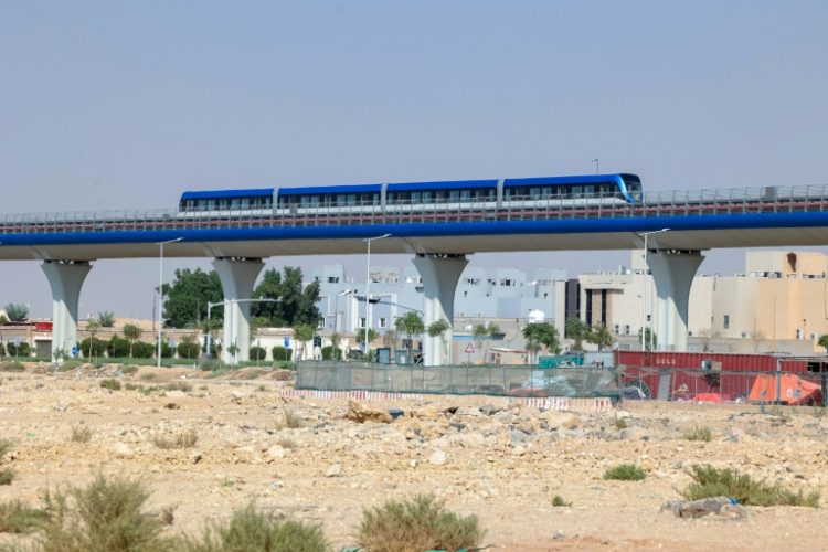 A train is tested ahead of the opening on Sunday of the first three lines of the Riyadh Metro, a major project intended to help shift car-centric Saudi Arabia to public transport.. ©AFP