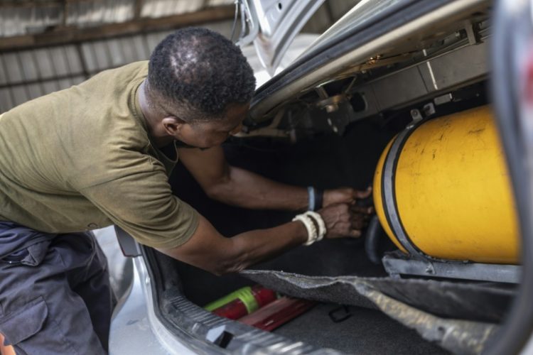 Faced with soaring petrol prices after an end to fuel subsidies, some Nigerians are convertng their cars to run on compressed natural gas. ©AFP