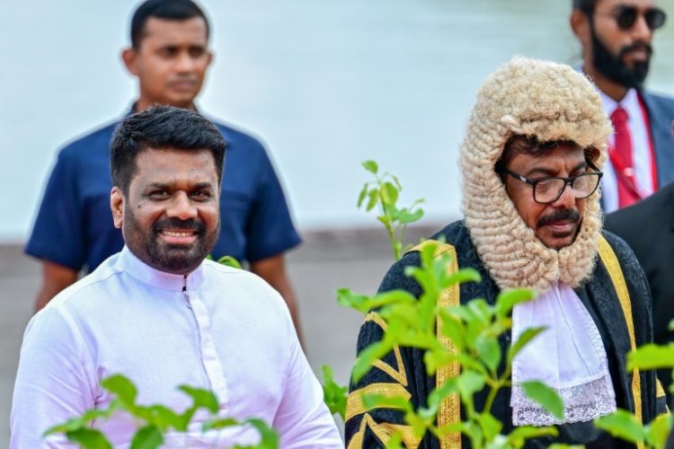 Sri Lanka's President Anura Kumara Dissanayake (L) and Speaker Ashoka Ranwala arrive for the opening of parliament. ©AFP