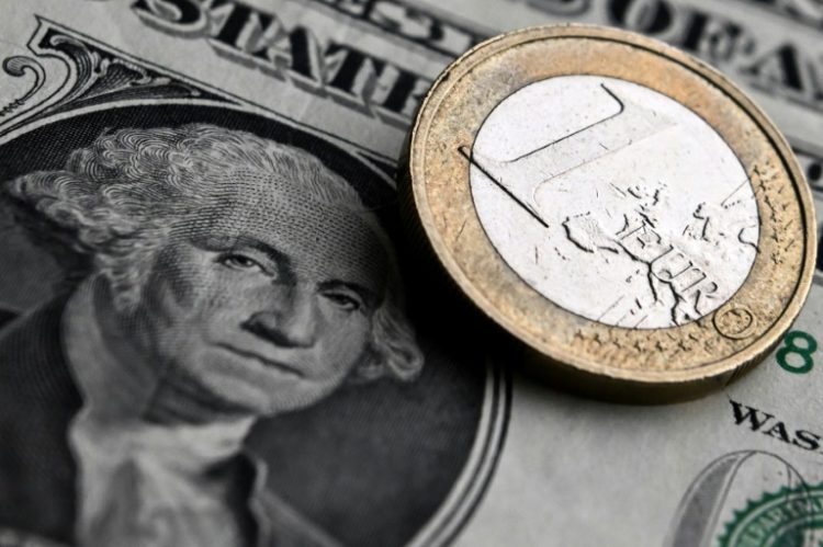 The euro hit a one-year dollar low on Tuesday, dropping below $1.06. ©AFP