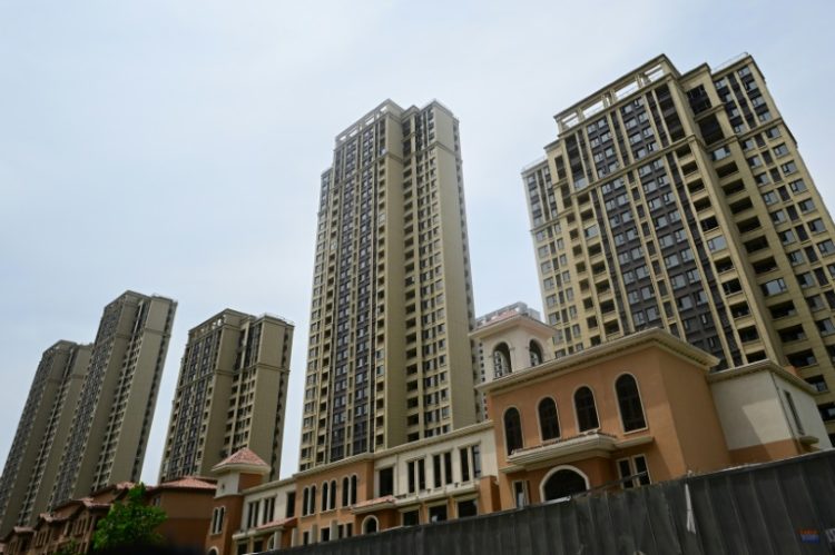 Unfinished apartments at a complex in  Xinzheng City in Zhengzhouin 2023. China is looking to slash taxes on home purchases as the government strengthens fiscal support for the ailing real estate sector. ©AFP