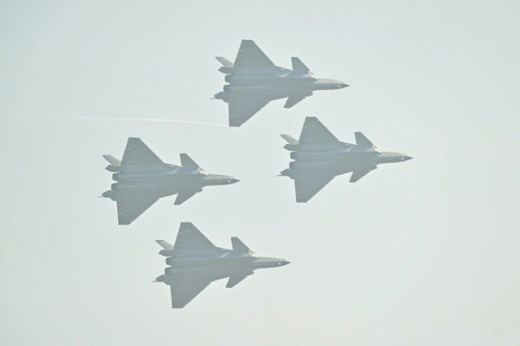 Chinese-made Chengdu J-20 stealth fighters fly in formation at Airshow China. ©AFP