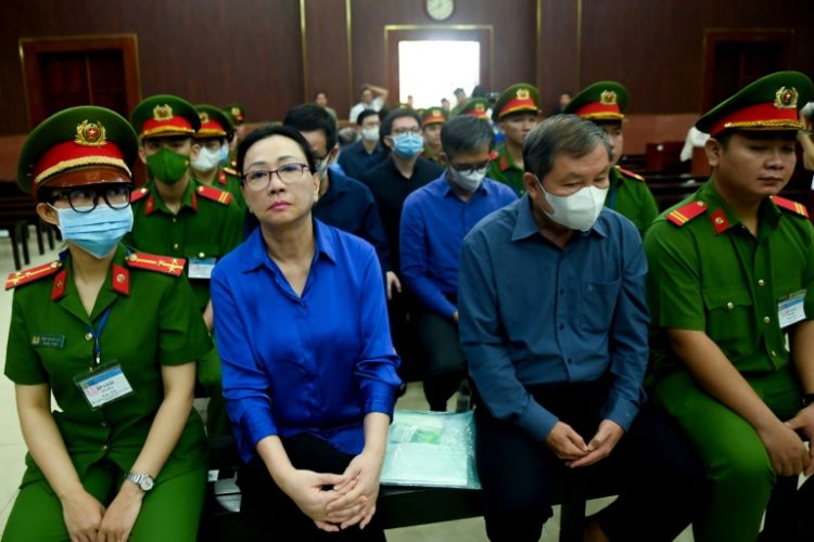 Vietnamese property tycoon Truong My Lan (2-L) is at the centre of a massive fraud case that has raised questions about the country's banking system. ©AFP