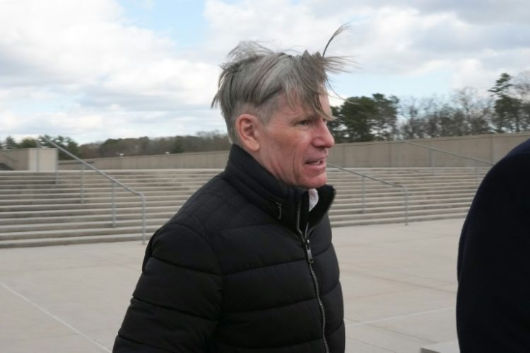 Briton Matthew Smith, the partner of former Abercrombie & Fitch CEO Michael Jeffries, leaves court in Central Islip, New York on December 3, 2024 . ©AFP