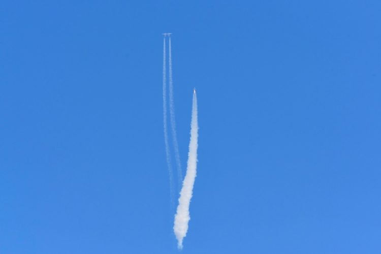 The Virgin Galactic SpaceShipTwo space plane Unity and mothership flies above Spaceport America, near Truth and Consequences, New Mexico on July 11, 2021. ©AFP