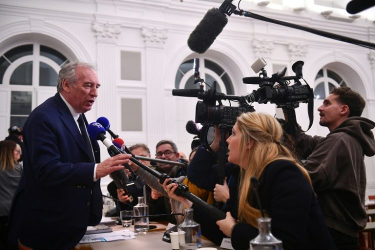 Newly appointed France's Prime Minister and mayor of Pau Francois Bayrou addresses media at the end of the municipal council at the town hall in Pau, southwestern France on December 16, 2024. ©AFP