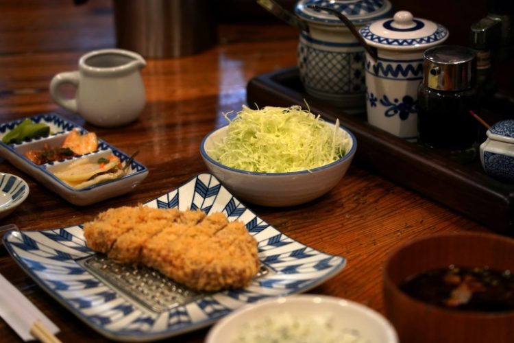 Japan's much-loved 'tonkatsu' pork cutlets come with a mound of freshly shredded cabbage, but a surge in the vegetable's price has prompted some chefs to skimp on servings. ©AFP