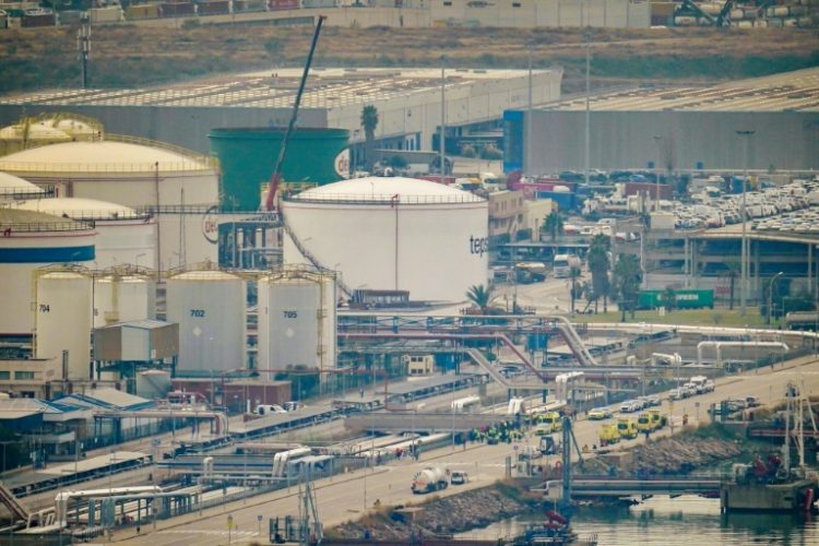 Emergency services deploy at Barcelona's port following an explosion of a tank containing a highly flammable substance. ©AFP