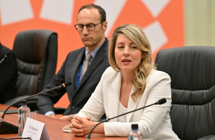 Canada's Foreign Minister Melanie Joly, pictured here at a November 14, 2024 meeting, is warning against a trade war with the United States under incoming President Donald Trump. ©AFP