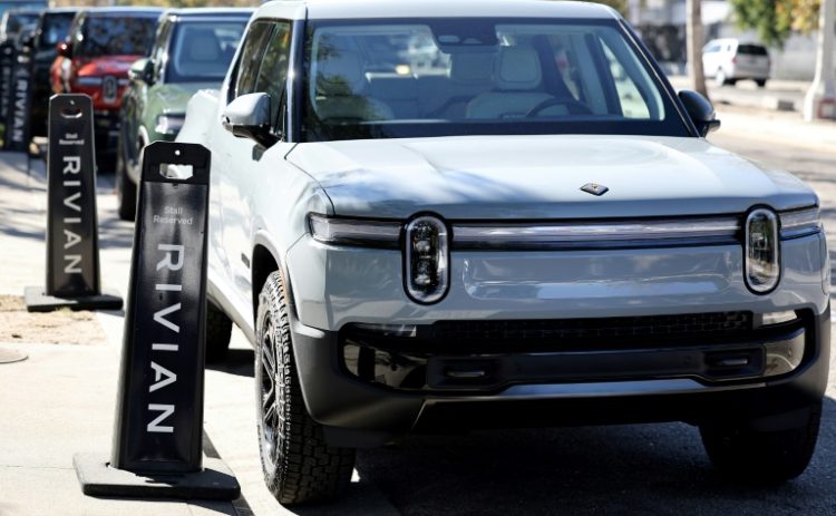 Shares of Rivian and other electric vehicle companies fell after US President Donald Trump issued an executive order targeting the EV industry . ©AFP