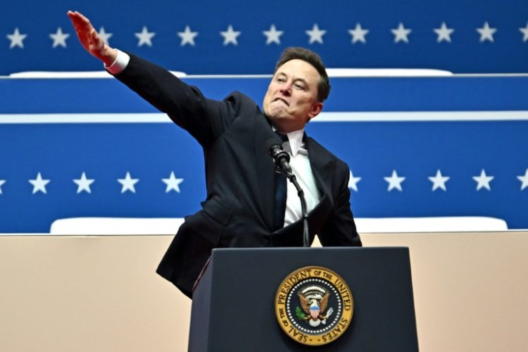 Billionaire Elon Musk gestures during an inaugural event for President Donald Trump inside Washington's Capitol One Arena on Inauguration Day. ©AFP