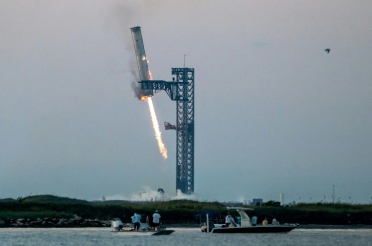 Space enthusiasts will be eager to see if SpaceX can replicate the feat of catching the first-stage Super Heavy booster in the launch tower's 'chopstick' arms during descent. ©AFP