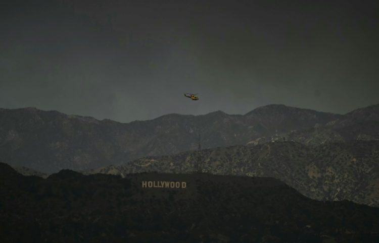 The wildfires raging around Los Angeles have also disrupted the economy as awards shows and film production have ground to a halt. ©AFP