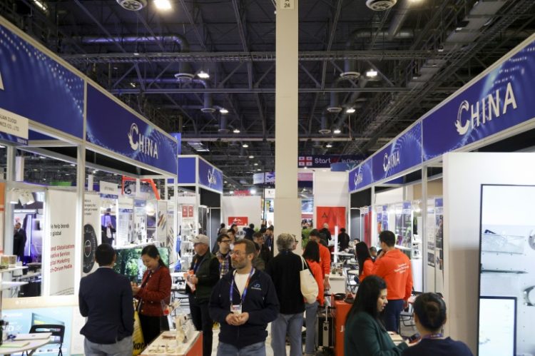 Attendees walk past a row of Chinese businesses at the annual Las Vegas tech show CES in January, 2024. ©AFP