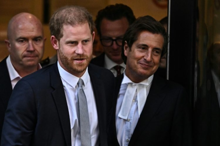 Prince Harry leaves court with his barrister, David Sherborne, after testifying in June that he had suffered lifelong press invasions. ©AFP