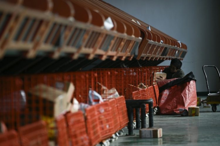 Shares in ecommerce firms fell in Hong Kong after the US Postal Service suspended inbound parcels from the city and China. ©AFP