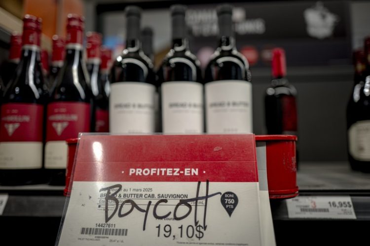 Graffiti calling to boycott American wine is seen at a liquor store in Montreal, Canada, on February 3, 2025. ©AFP