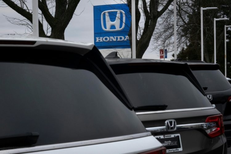 Honda shares surge in Tokyo as Japanese media said the automaker had proposed making its struggling rival Nissan a subsidiary. ©AFP