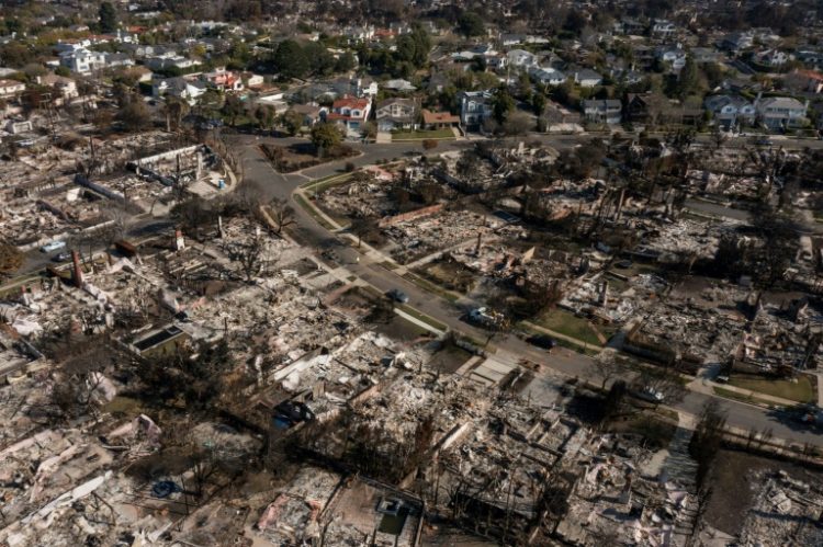 An aerial image shows homes damaged and destroyed by the Palisades Fire in the Pacific Palisades neighborhood of Los Angeles, California, on January 29, 2025.. ©AFP