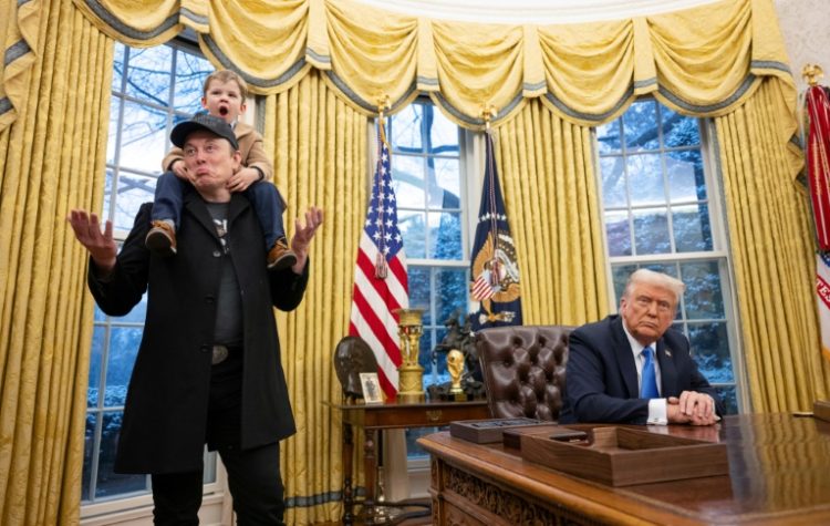 Tesla and SpaceX CEO Elon Musk with his son X Æ A-Xii join US President Donald Trump as he signs executive orders in the Oval Office of the White House in Washington, DC, February 11, 2025. . ©AFP