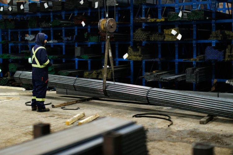 A worker moves steel product at North York Iron, a supplier in Toronto, where people have expressed concern over US President Donald Trump's plans to slap import tariffs on Canadian steel . ©AFP