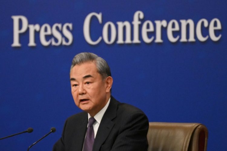 Speaking at a press conference on the sidelines of a key political meeting, Wang Yi warned the "law of the jungle" could take hold in the world. ©AFP