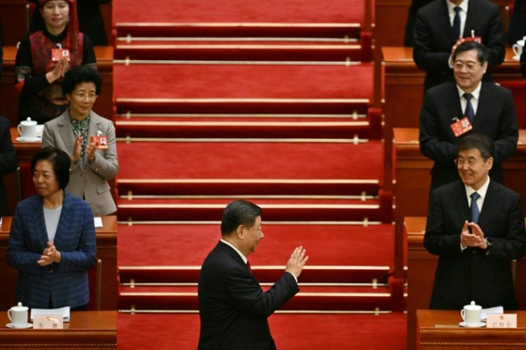 China's President Xi Jinping arrives for the opening session of the National People's Congress (NPC) on Wednesday. ©AFP