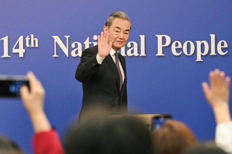 At a press conference on the sidelines of a key political meeting, China's top diplomat sought to frame Beijing as a bulwark of stability in an unstable world. ©AFP